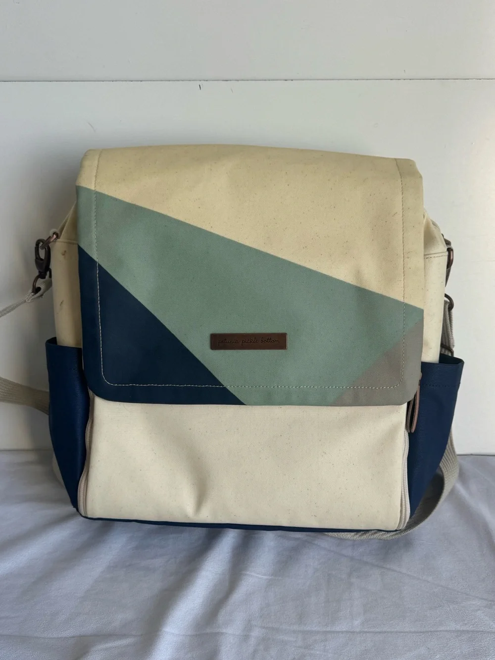 Petunia Pickle Bottom Boxy Backpack Diaper Bag in a geometric cream, navy, teal